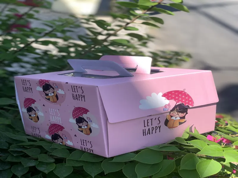 Hộp đựng bánh kem có quai xách hồng Let's Happy